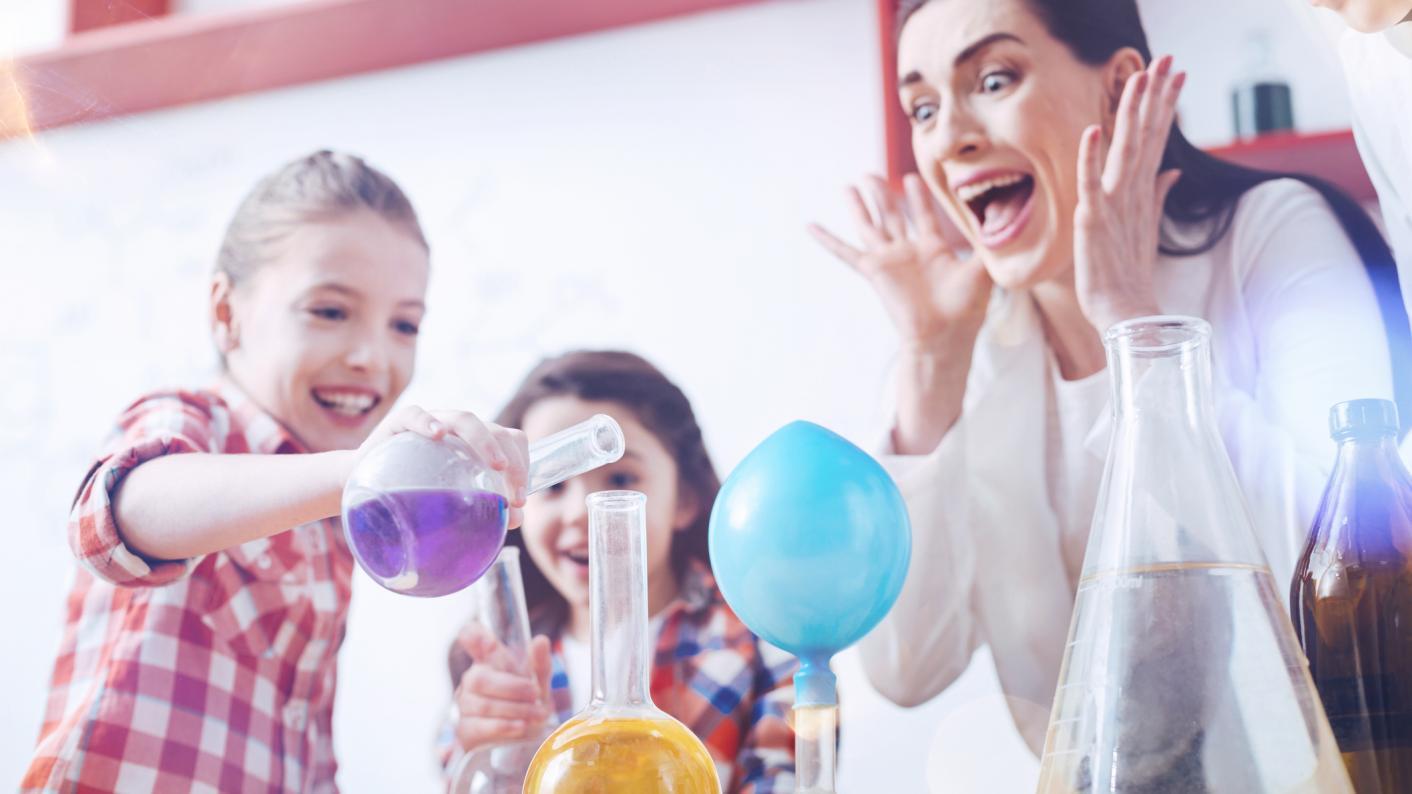 Pupils carrying out fun science experiments with science flasks.